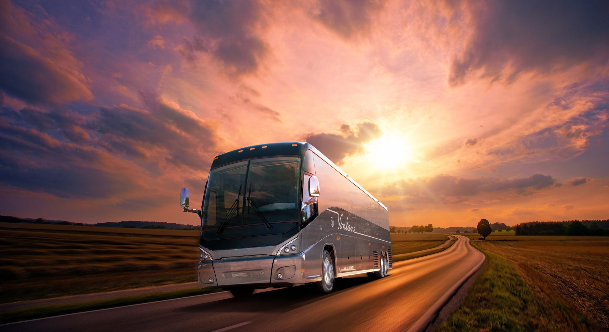 Luxury coach on the highway at sunset